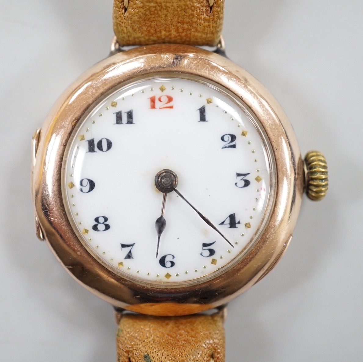 A gentleman's George V 9ct gold Rolex manual wind wrist watch, with Arabic dial, case hallmarked for London, 1915, the case back with engraved initials, on a later associated leather strap, case diameter 28mm.